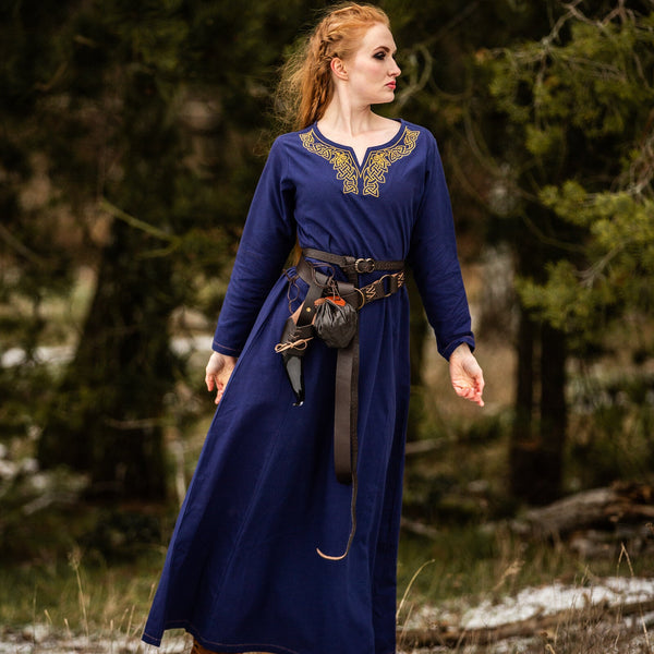 Front view of blue cotton dress featuring embroidered neckline and relaxed fit