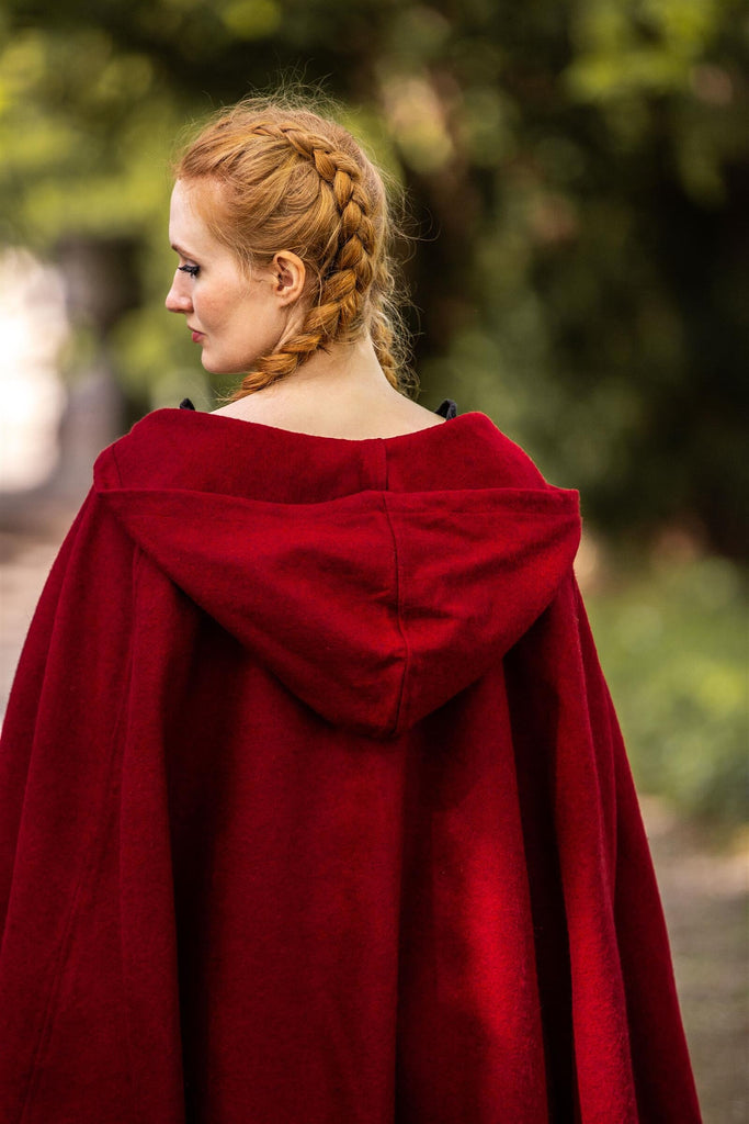 Back view of hooded cape showing full drape and integrated hood